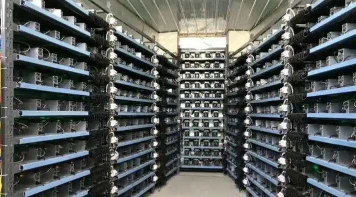 Aerial view of a large-scale mining farm powered by a dedicated solar power installation, exemplifying sustainable energy practices